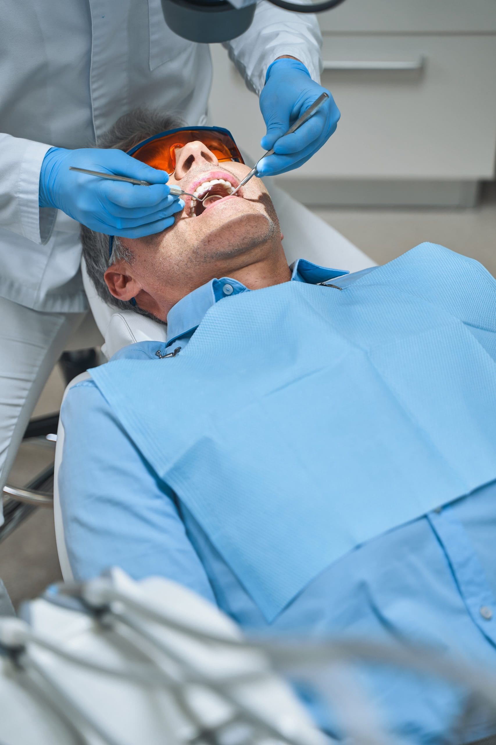 Man during teeth check up stock photo
